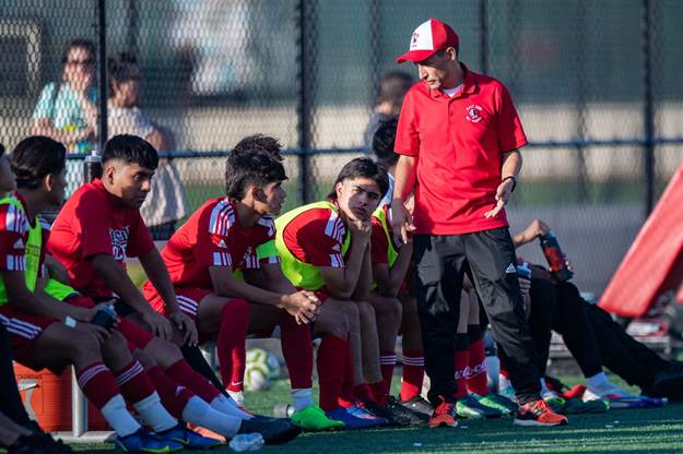 Newark East Side head coach Jose Pereira talks to his players during the boys soccer game against Seton Hall Prep in Newark<br>October 11, 2022.John Jones | For NJ Advance Media