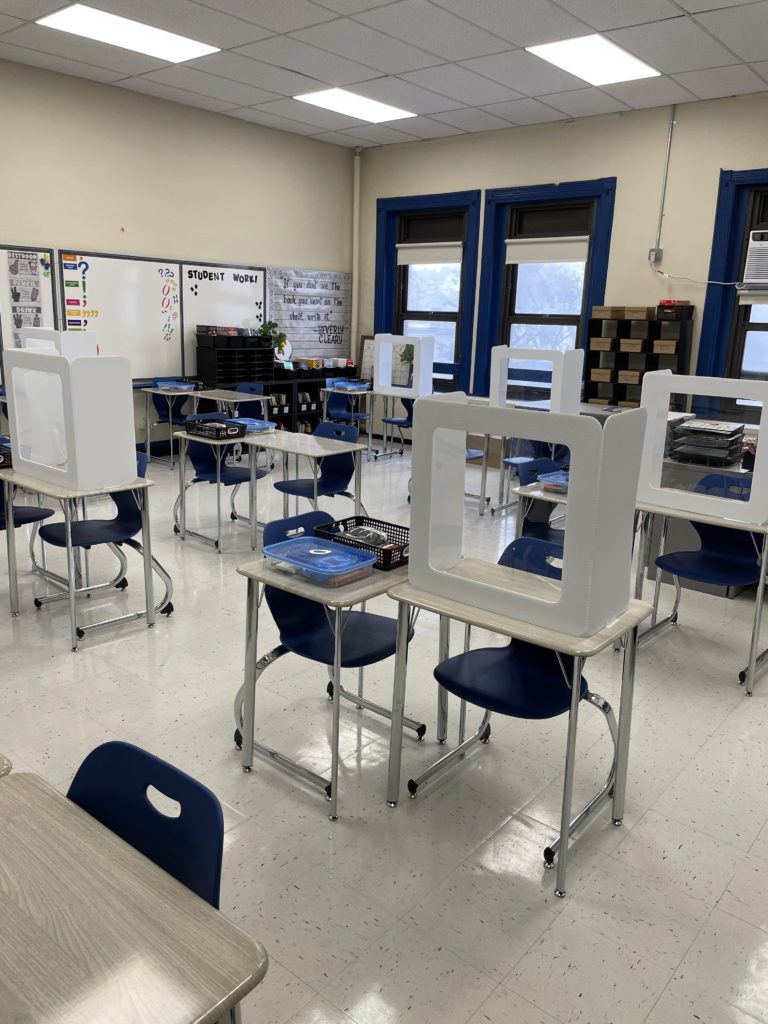 Desk guards keep students safe.