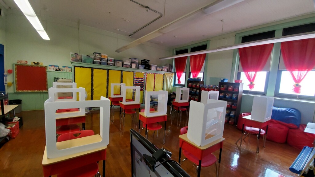 Desk guards keep students safe.