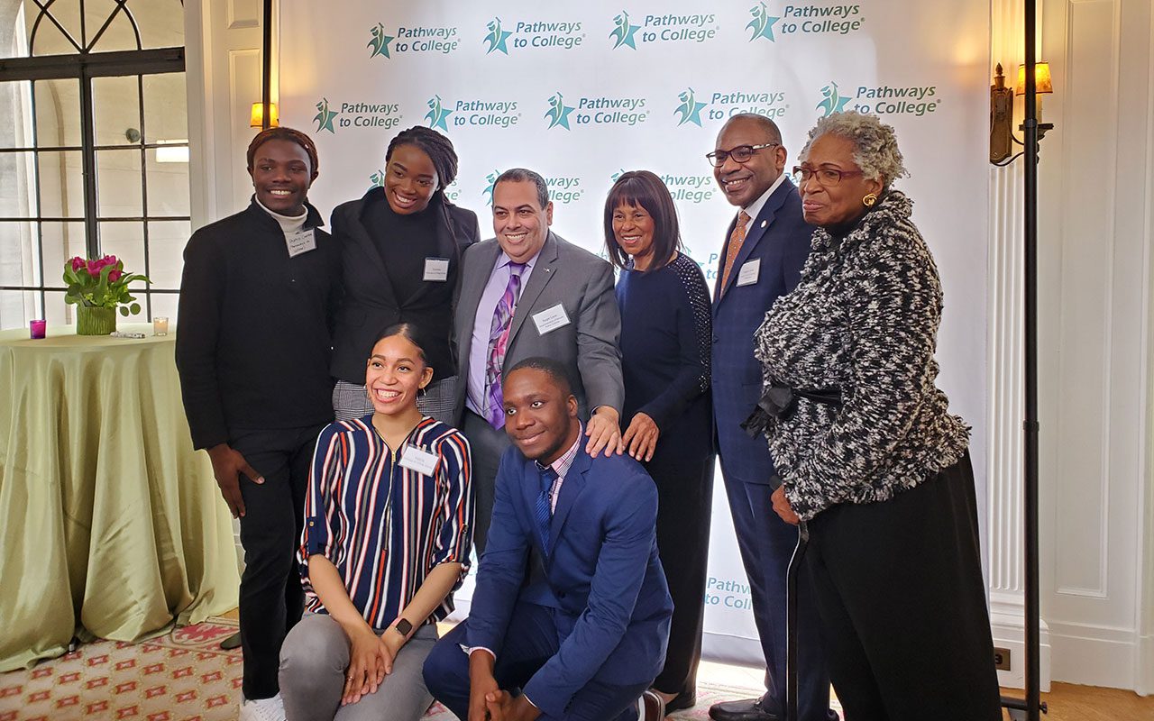 Pictured with Superintendent León is Dr. Judith Griffin (President of Pathways to College).  They are flanked by Seniors Shahid Carter, Sumwen Osagie, Valerie Valle, and Alum Jaevon Lawrence with Reggie Lewis and Wilhelmina Holder.