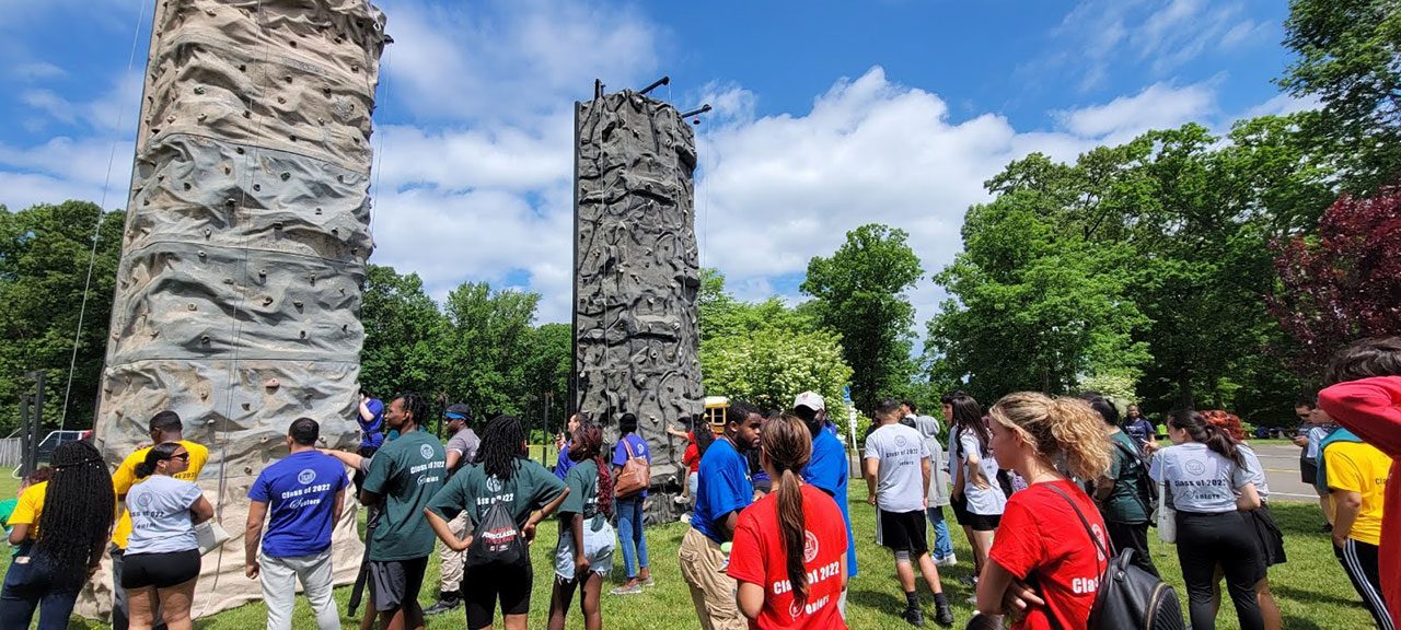 Student participants tested their endurance, physical, and mental skills during the rock climbing wall attraction