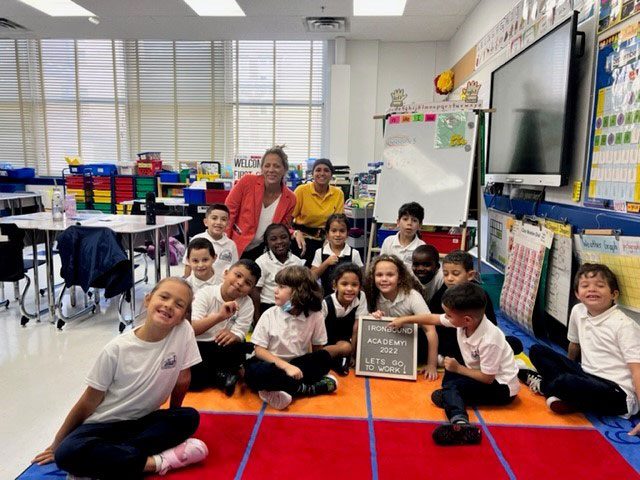 Principal Erica Paich of the Ironbound Academy Elementary School and smiling faces of students!