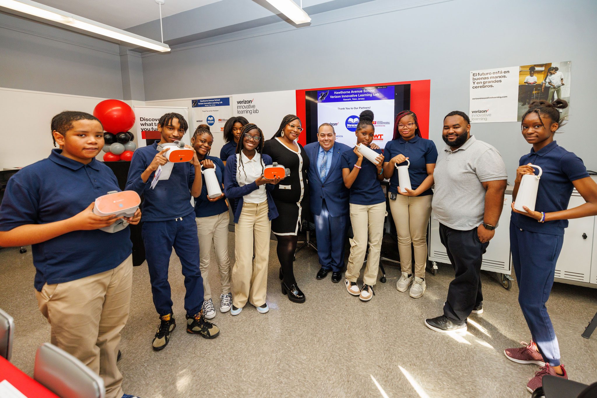 Students celebrating their new Verizon Innovative Learning Lab